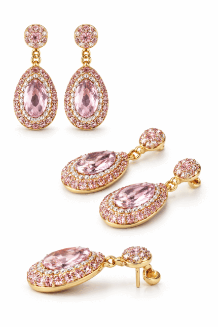 أقراط ذهبية أنيقة مرصعة بحجر وردي بيضاوي محاط بكريستالات لامعة بتصميم فاخر.